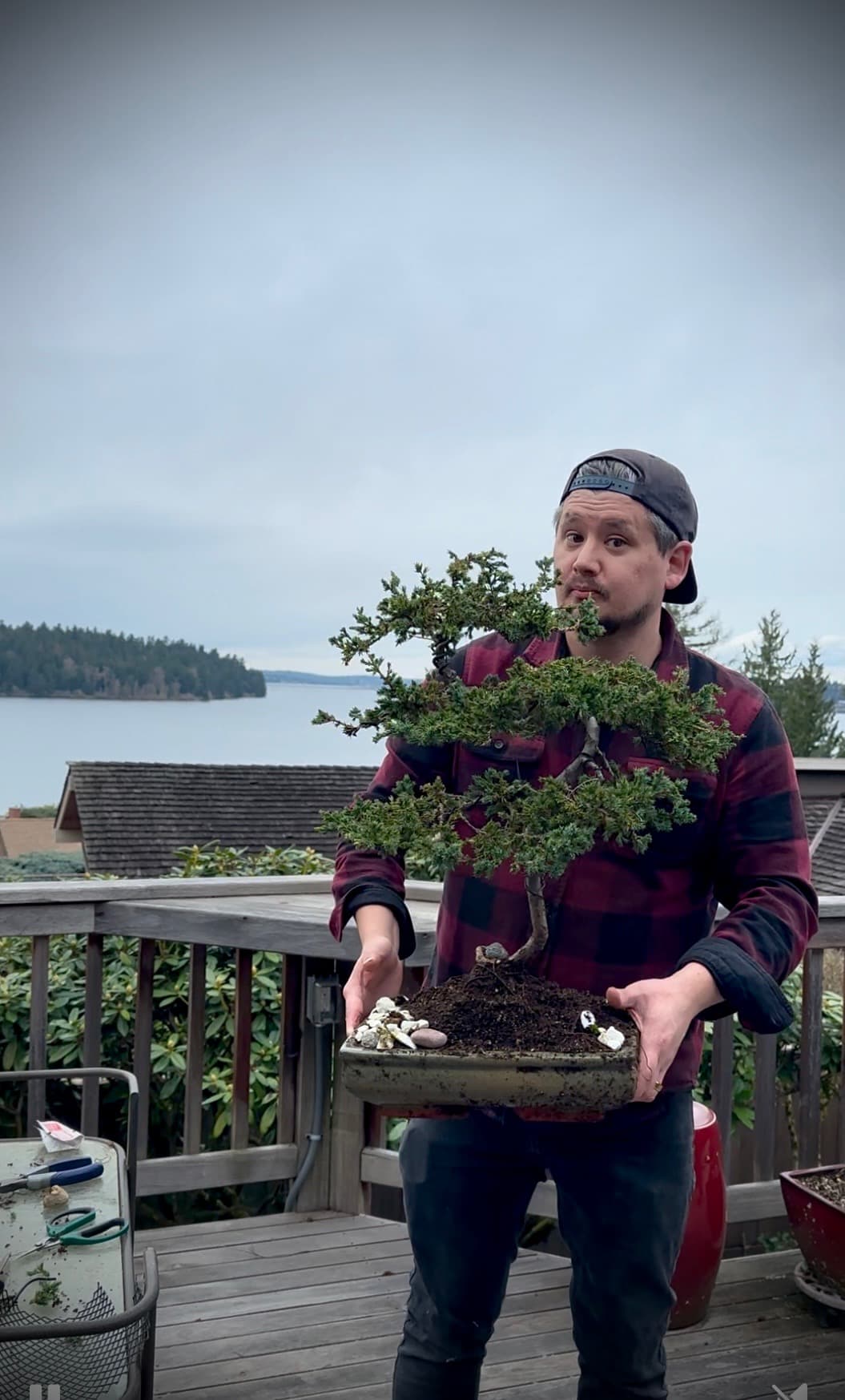 Christopher Poett working on a bonsai